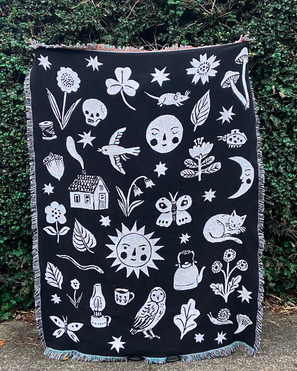 Phoebe's beautiful woven throw blankets are back! The Solstice Throw Blanket features a black and white design of whimsical nature doodles. These amazing woven works of art can be hung on the wall as a tapestry or used as a throw to brighten up your space.