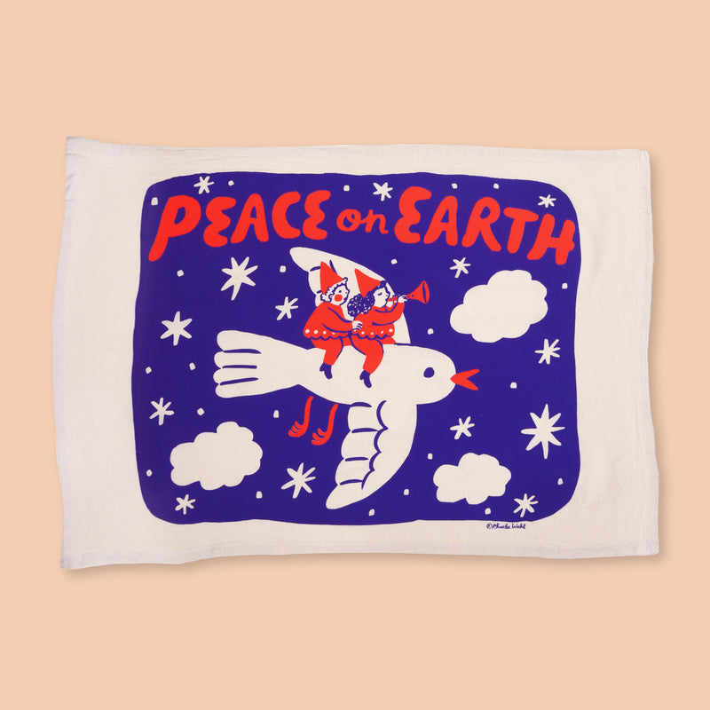 Celebrate a peaceful holiday season with an illustrated tea towel! This lively design is screenprinted on fair-trade, unbleached cotton and can be displayed on a wall or in the kitchen.