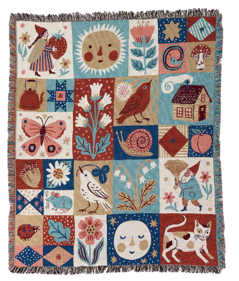 Phoebe's beautiful woven throw blankets are back! The Sunshine Throw Blanket is a wonder-filled patchwork design that includes classic Phoebe Wahl imagery of mushrooms, gnomes, and flowers. These amazing woven works of art can be hung on the wall as a tapestry or used as a throw to brighten up your space. 